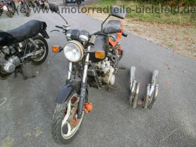 Suzuki_GS_650_G_KATANA_teilzerlegt_orig__Auspuff_-_wie_GS_500_550_750_1100_D_E_G_ES_EF_Katana_11.jpg